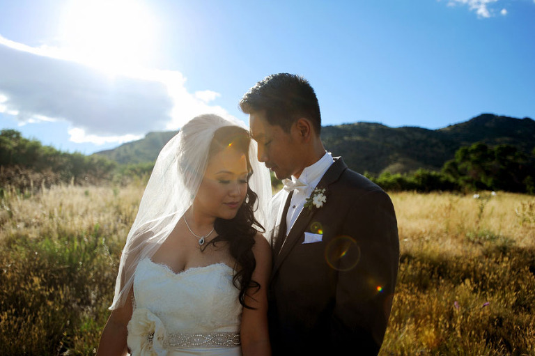 Portraits of a bride and groom in from of Red Rocks in Colorado. - True North Photography Kira (Horvath) Vos