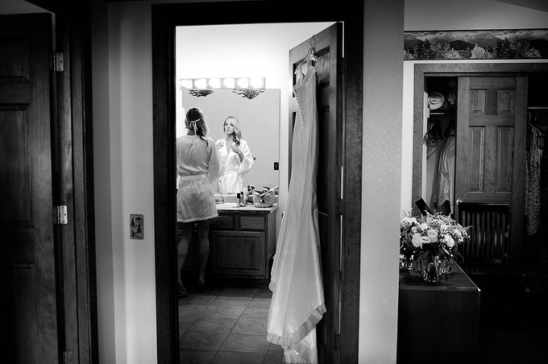 Bride getting ready at the Black Canyon Inn for a Colorado mountain wedding. - Kira Horvath Photography