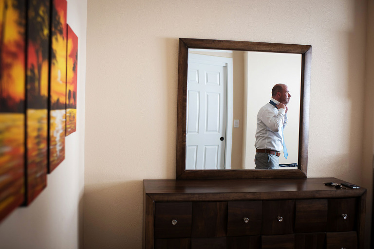 Groom getting ready for a spring wedding at the Shannon Red barn in Boulder, Colorado. - True North Photography Kira Vos (Horvath)